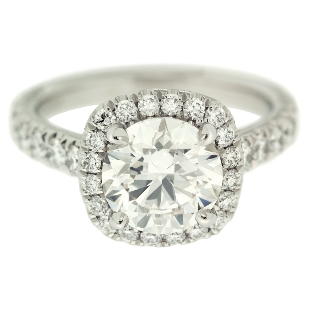 round brilliant cut diamond with halo engagement ring