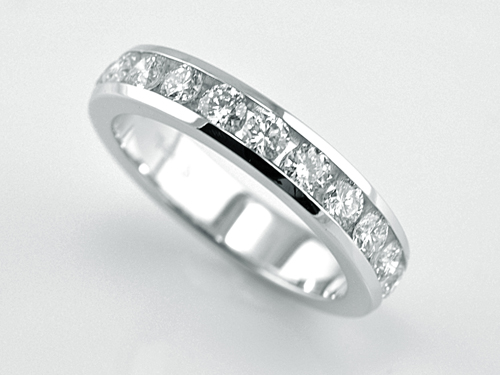 channel set diamond eternity wedding band in 14 karat white gold